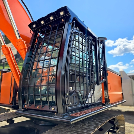 Hitachi excavator front view of full cab guarding on machine