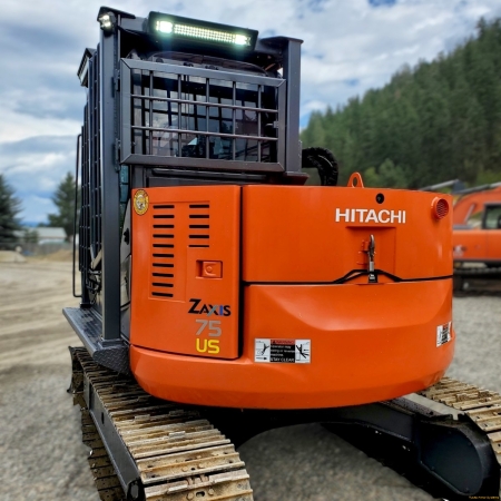 Rear view of Hitachi ZX75US with cab guarding