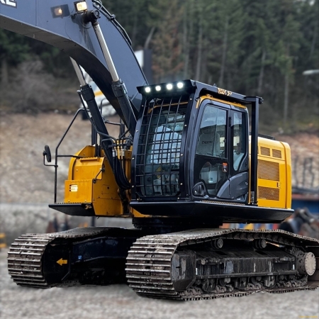 John Deere excavator in front of hillside